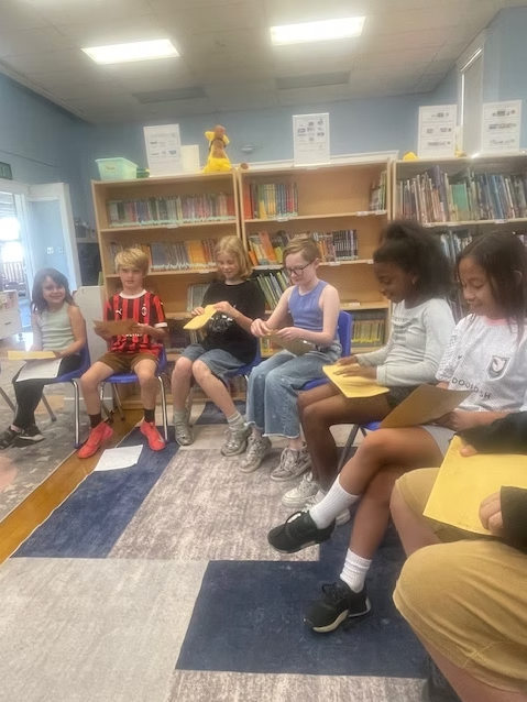 Students at Norma Coombs School writing letters to their pen pals
