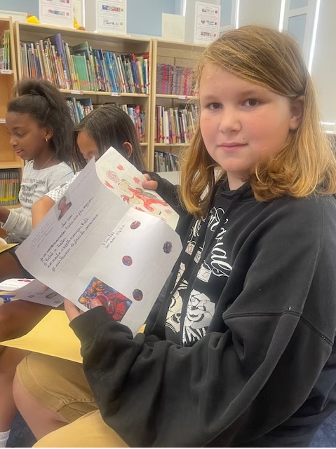 Students sharing photos and letters from Senegal